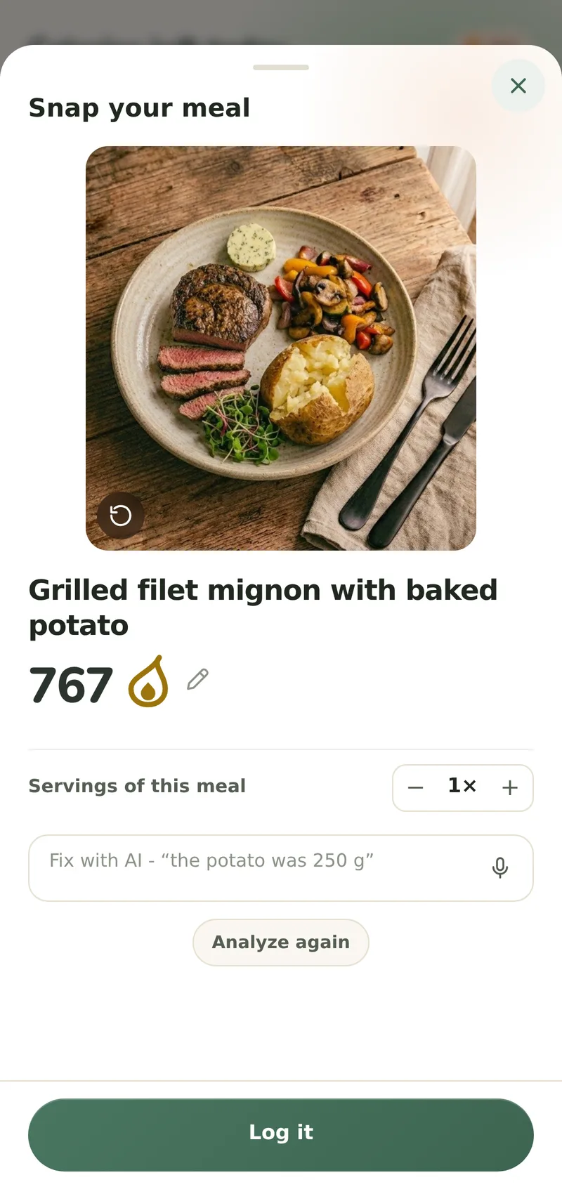 The capture sheet over Home: the photographed plate of sliced steak, a baked potato, mushrooms and peppers and a herb butter, a fork and knife on the napkin beside it, logged as one meal with one calorie total you can retype, a Servings of this meal stepper, an empty Fix with AI field with its dictation mic, an Analyze again chip and a Log it button